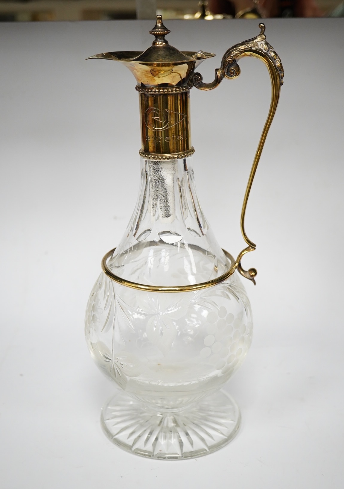 A modern silver gilt mounted cut glass pyriform claret jug, maker JM, Sheffield, 2001, 31.2cm. Condition - good
